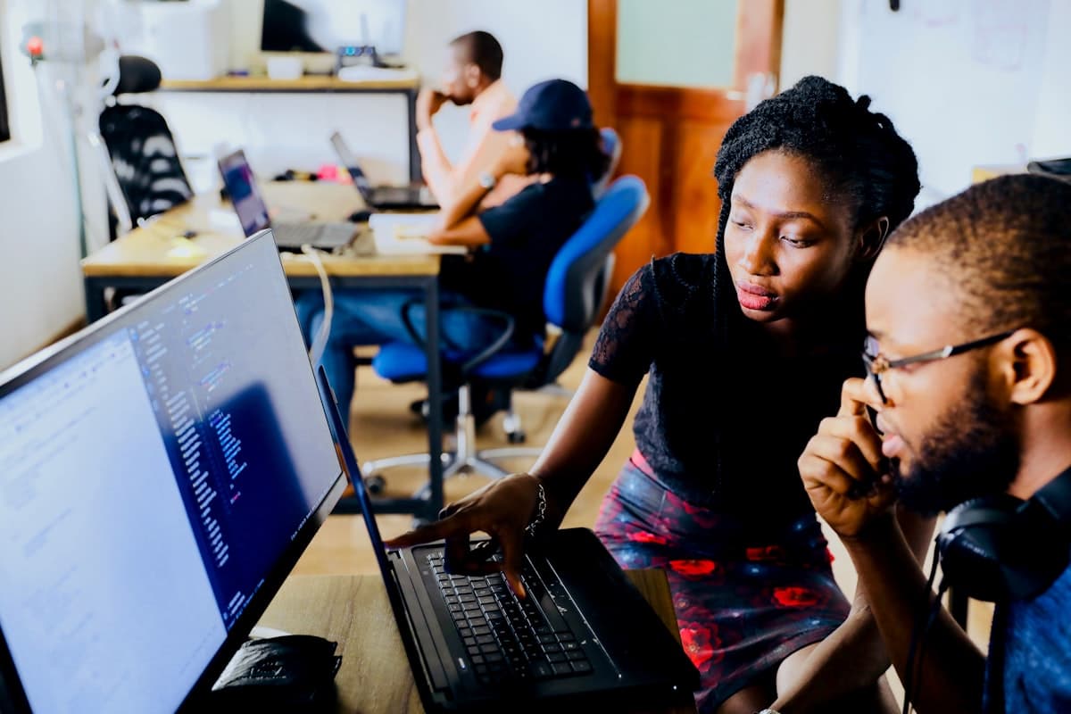 Engineers reviewing code together during a sprint